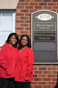 Dr. Allen and Dr. Tatem standing outside their dental practice in Fredericksburg